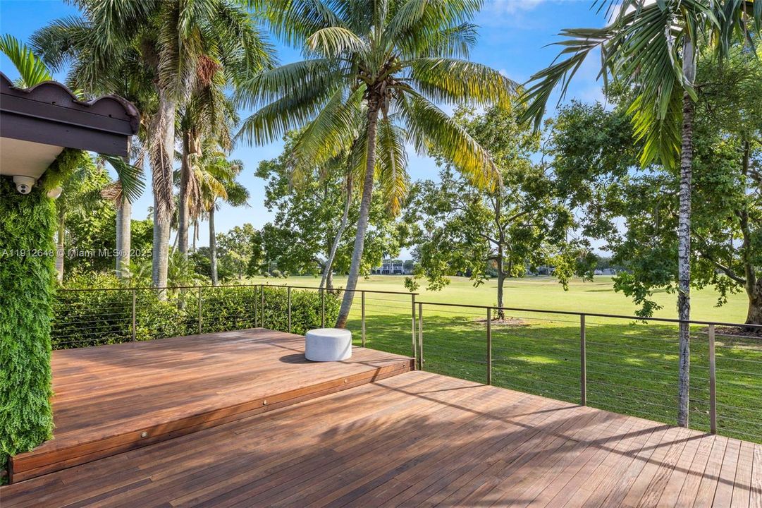 Golf course view onto tropical oasis.