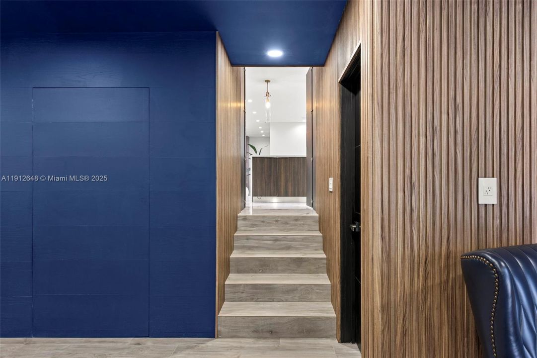 Going upstairs from Entertainment area into kitchen area (main floor)