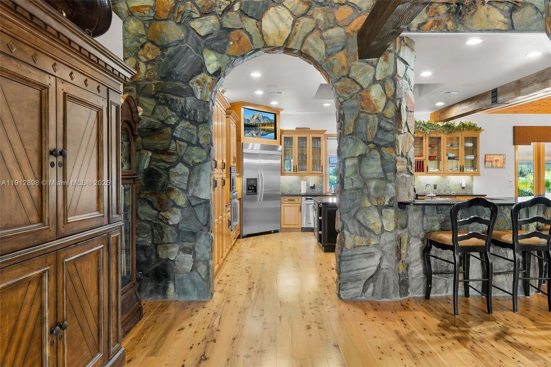 Stone archway to kitchen