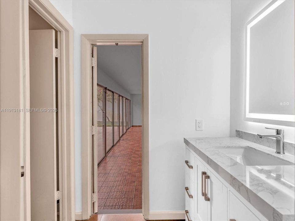 This bathroom serves guests, two bedrooms and has access points from the flex room and family room areas.