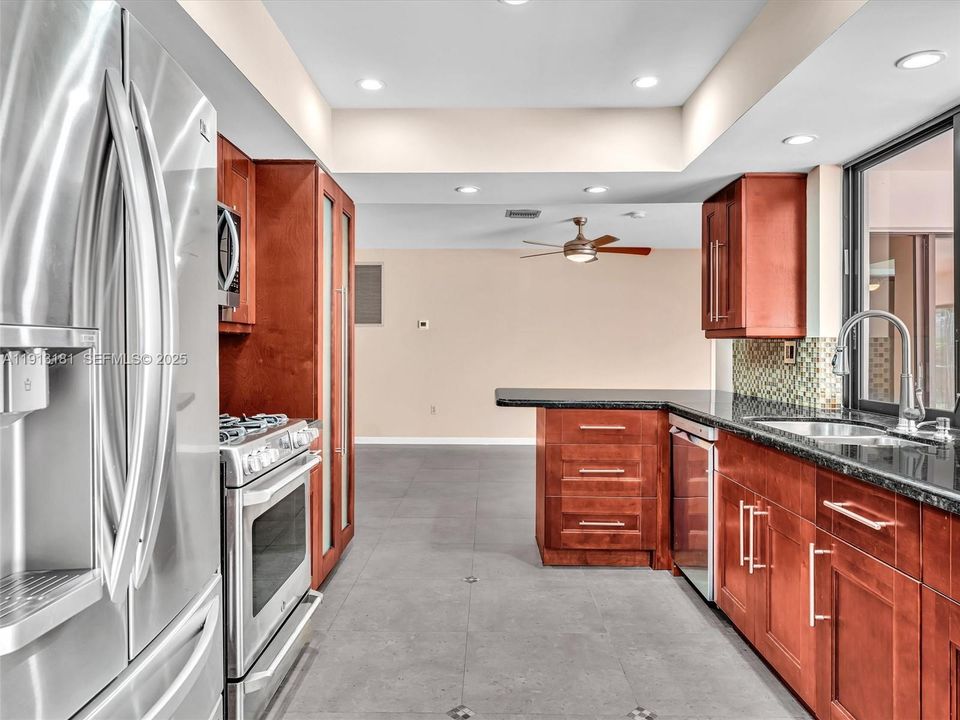 The custom kitchen focuses on gas powered stovetop/oven and LG appliances throughout. Smart storage options throughout the cabinetry. The passthrough window to the Flex Room is a family favorite!
