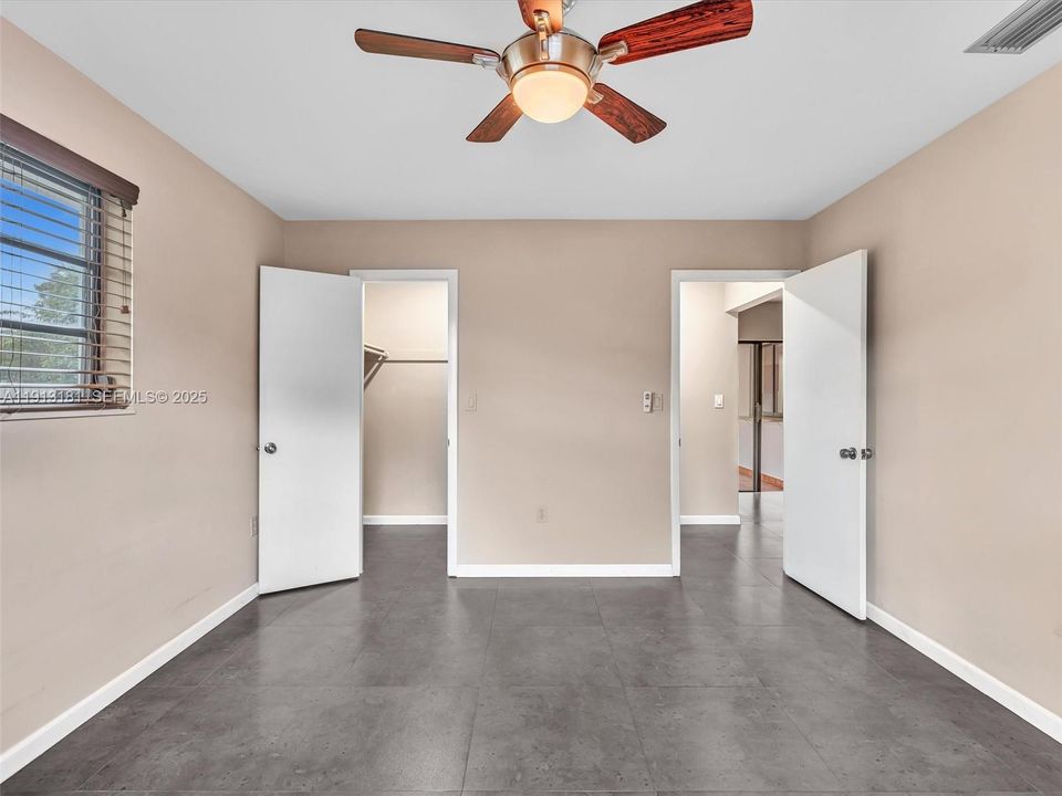 Bedroom 3 has a walk in closet and ceiling fan