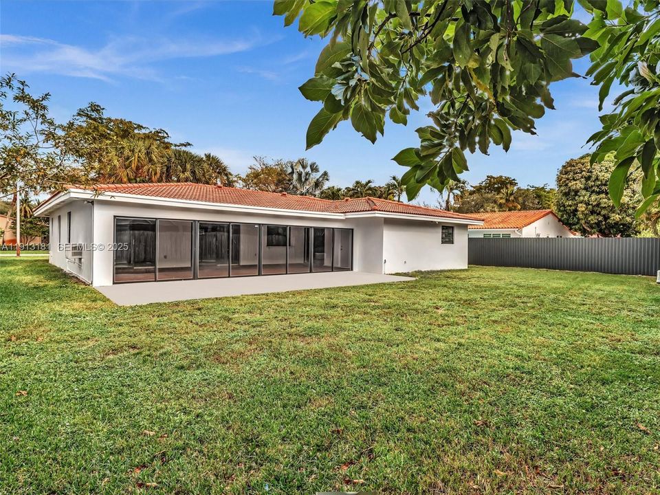 Expansive backyard has space for endless possibilities including a pool, pergola, outdoor kitchen.