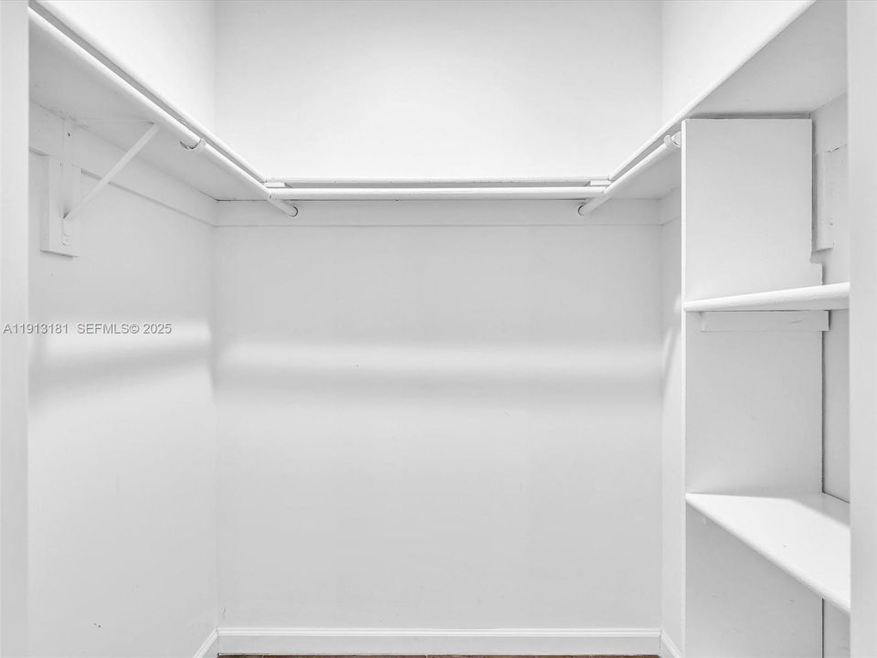 Walk in closet provides ample storage