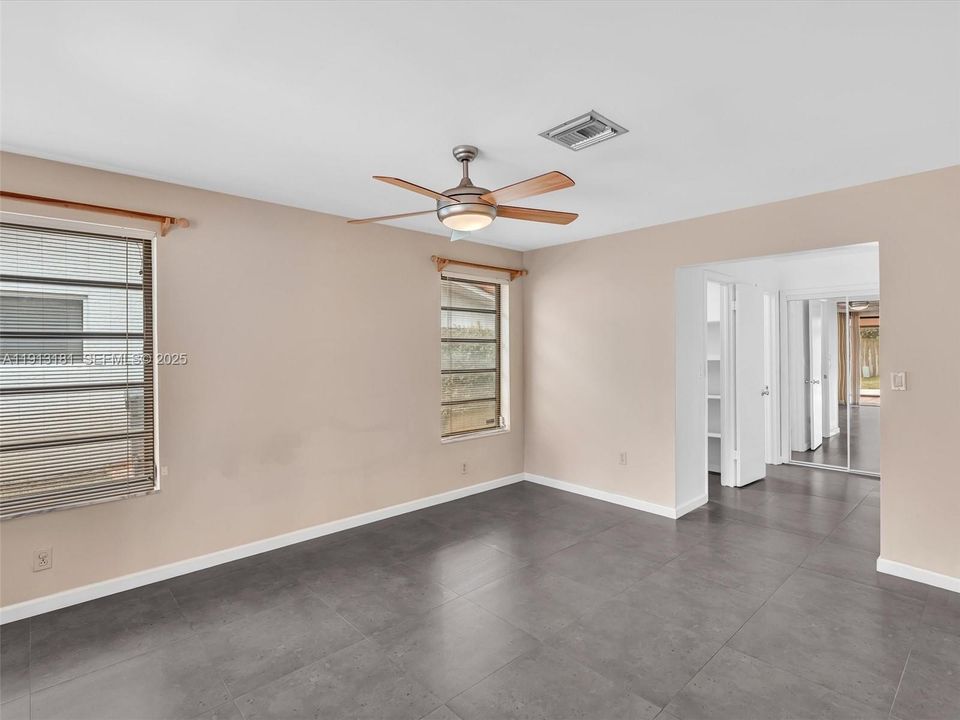 Primary suite has a large floorplan and a walk-in closet, linen closet, and double wide closet with mirror sliding doors