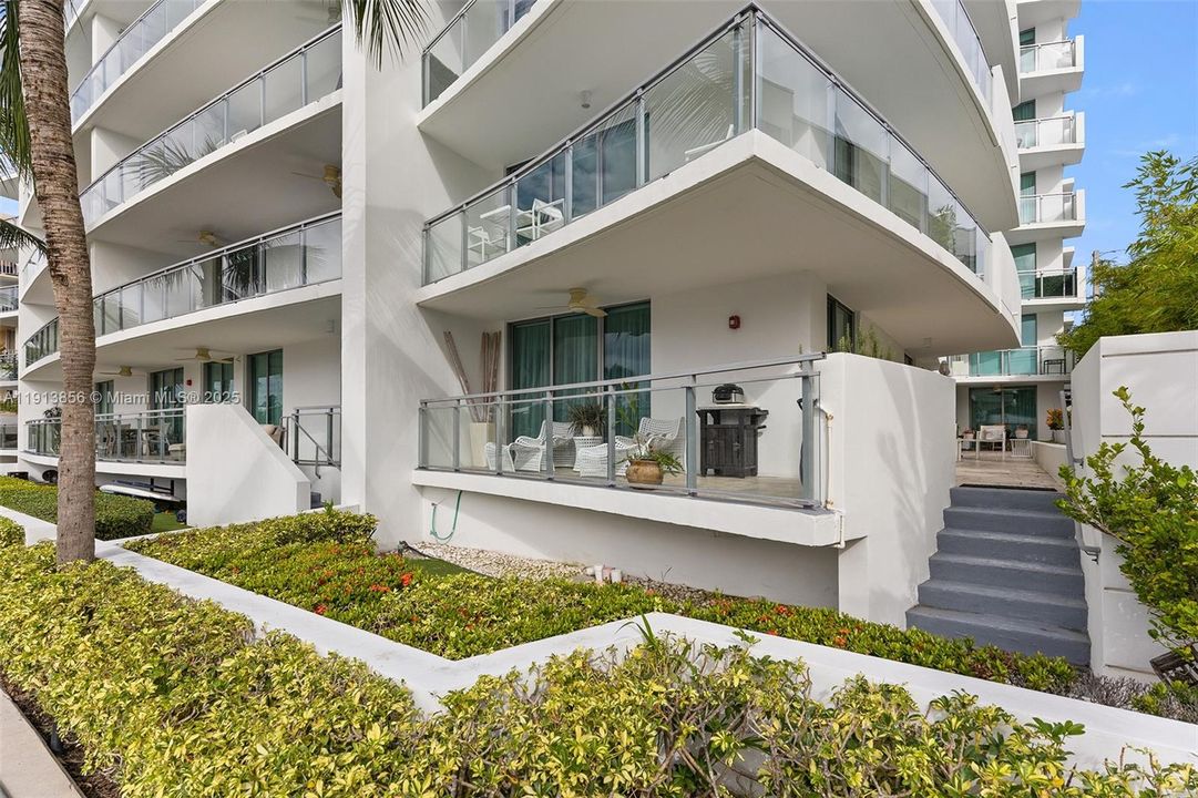 Corner patio with entrance to private side yard.