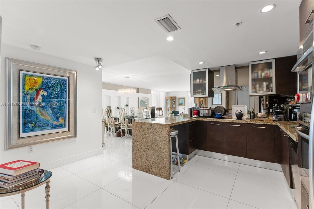 Open kitchen with two full size refrigerators