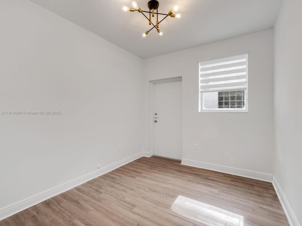 Bedroom #1 with Side Entrance to Parking