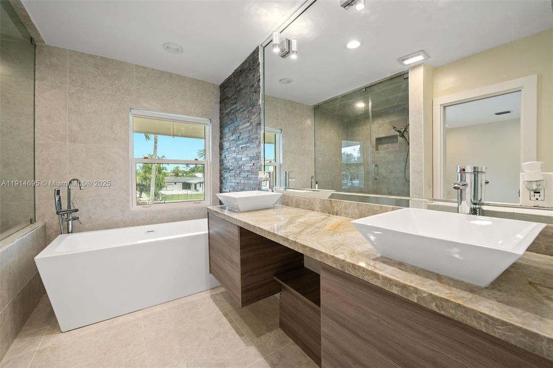 MODERN PRIMARY BATH WITH: STEAM SHOWER, SOAKING TUB AND BIDET & TOILET RM.