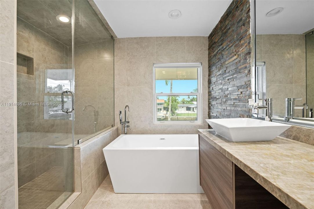 MODERN PRIMARY BATH WITH: STEAM SHOWER, SOAKING TUB AND BIDET & TOILET RM.