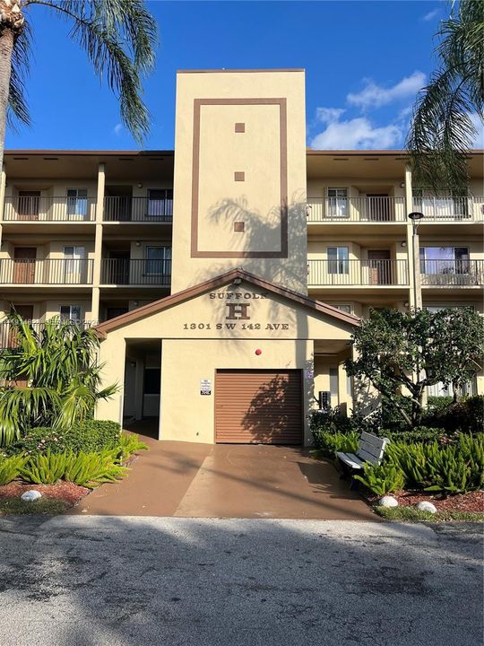 main entrance at center of bldg with elevator access / trash chut / mail boxes parking space for 301-H is directly in front for easy access