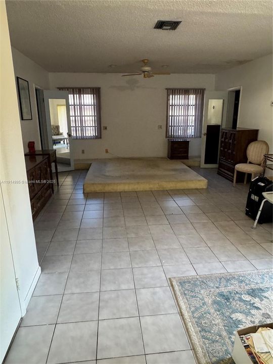 Very large primary Bedroom - has two large walk-in closets. Sitting area by sliding glass doors in this room with access to private patio outside. Bedroom has split system A/C for this room. (Primary Bathroom off to side - see other photos)