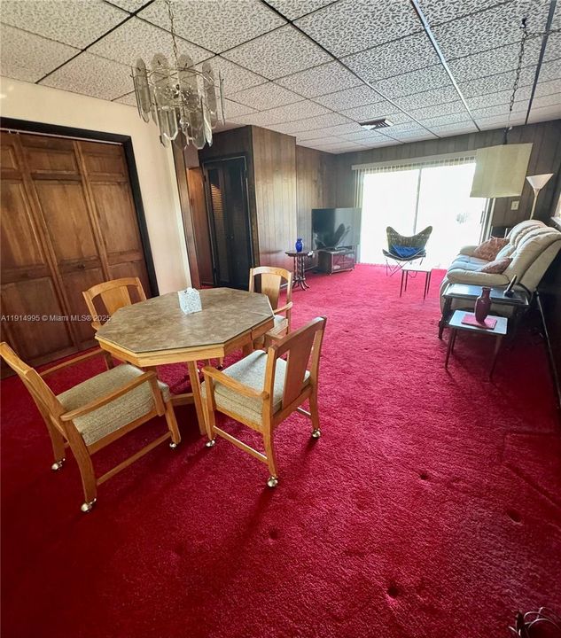 Huge family room at end of the home with sliding glass doors to the pool/patio. It has a large closet for storage.