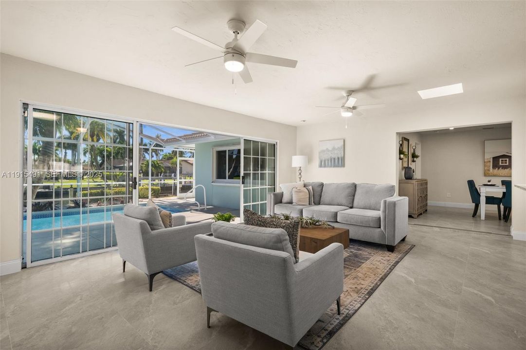 Family room with sliding doors to the screened pool area