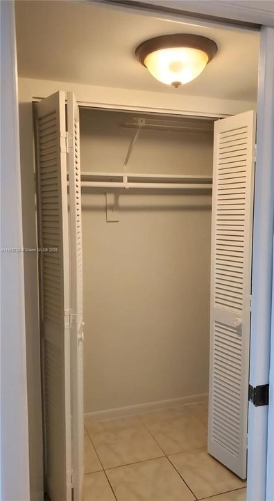 In hall way between bedroom and bathroom