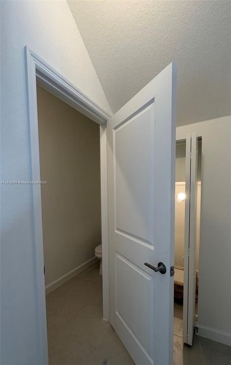 half bathroom and storage closet