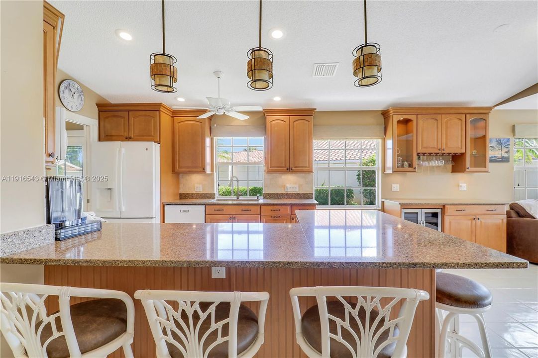 Large kitchen peninsula with feature lighting