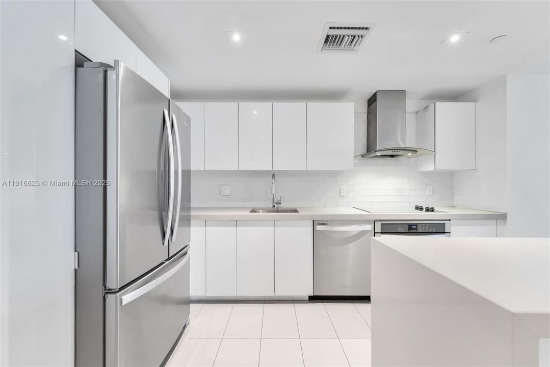 Modern kitchen with stainless stell appliances and