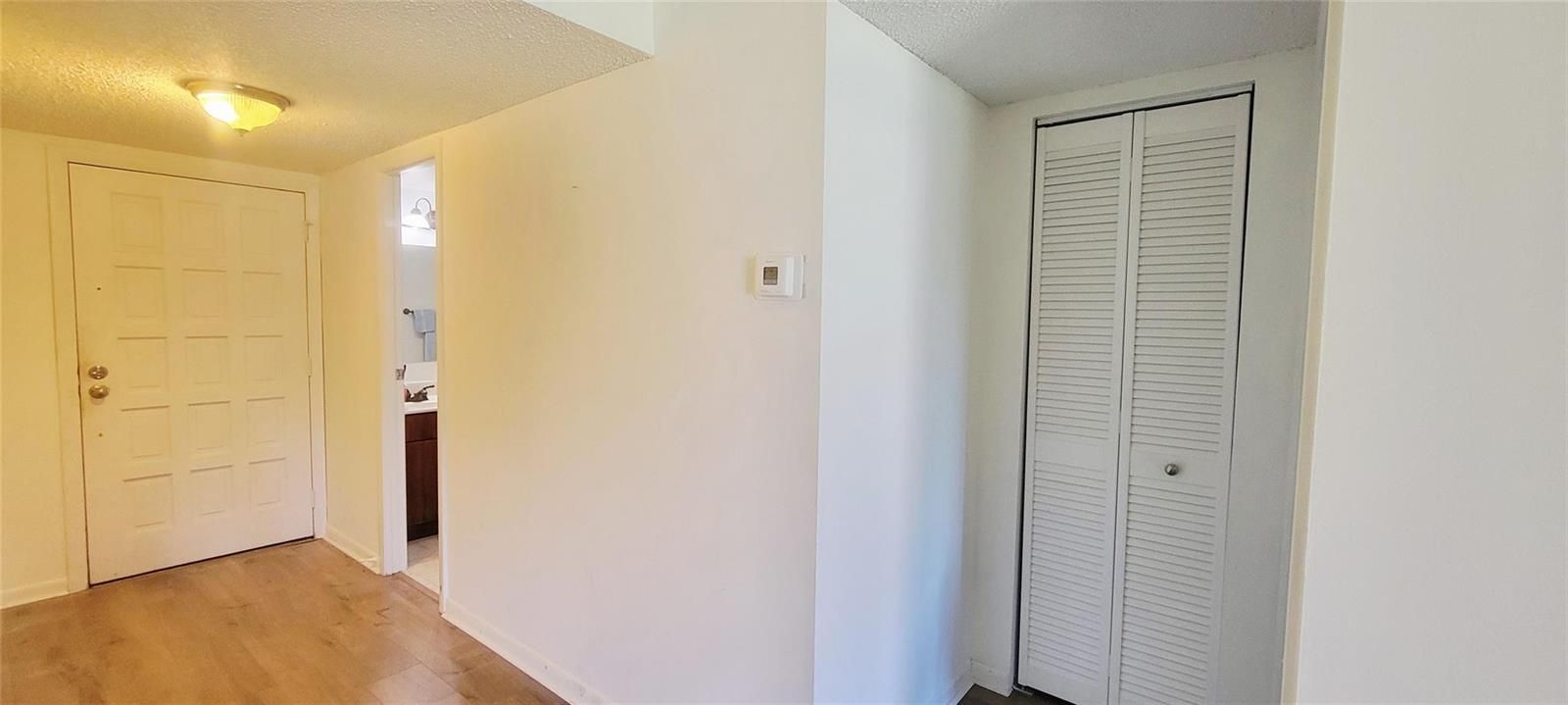 Foyer area including hall closet