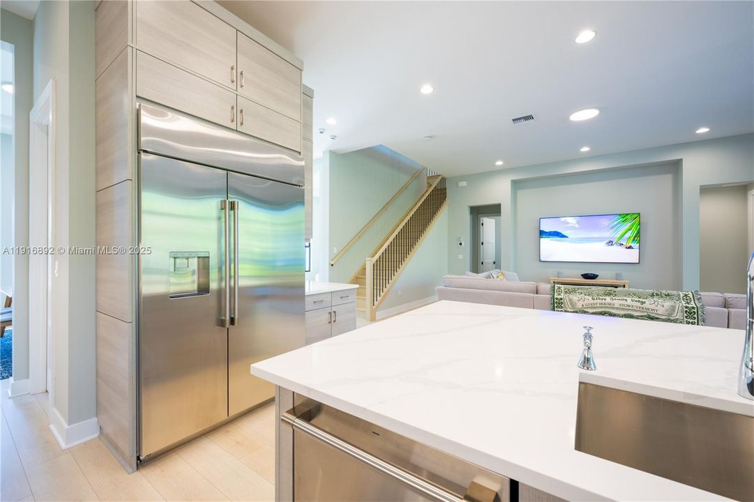 Pristine monogram refrigerator and dishwasher with plenty of storage