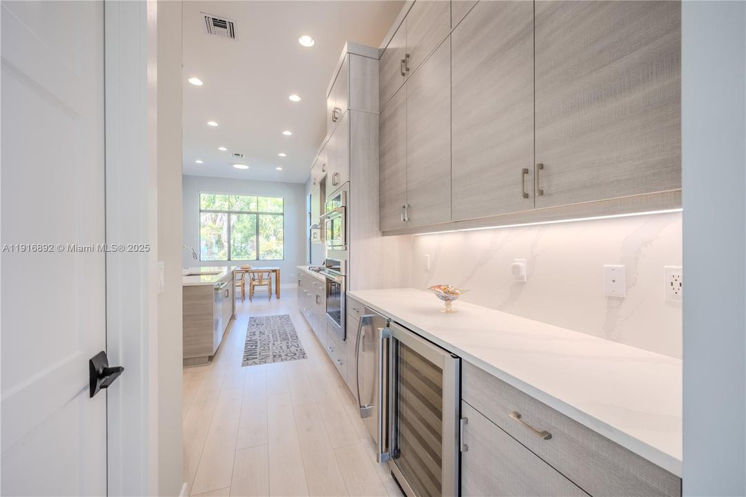 Monogram wine reserve and Ice maker under quartz countertop