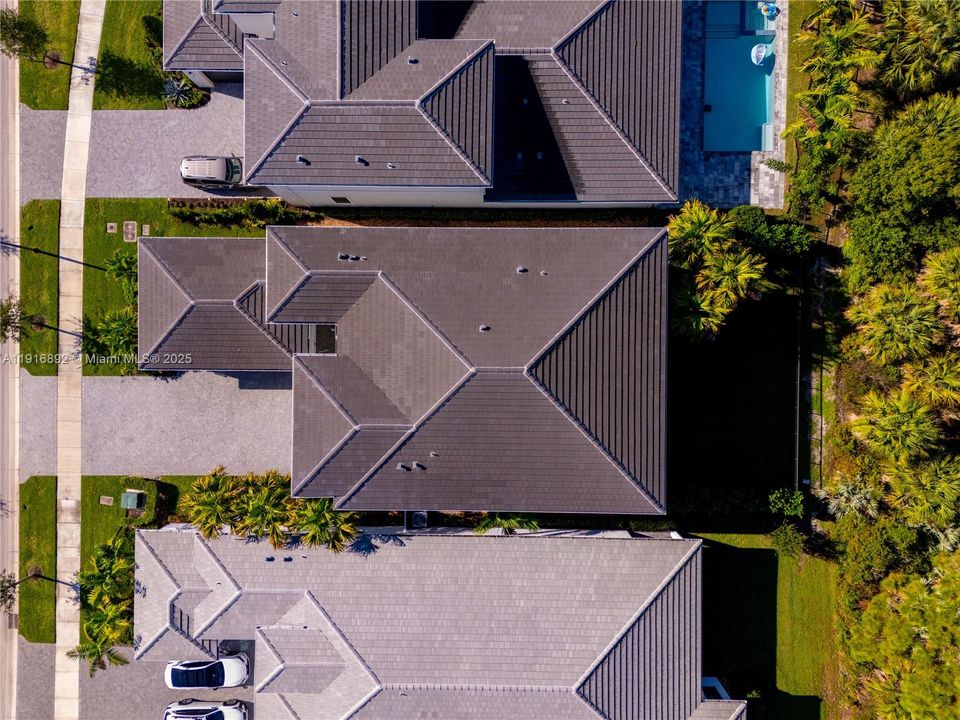 Overhead lot view highlighted by tropical landscaping