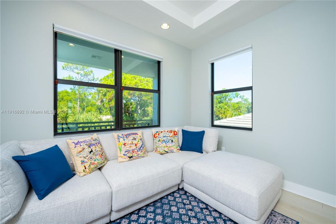 Master bedroom's sitting area surrounded by nature