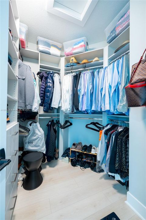 His walk-in closet in master bedroom