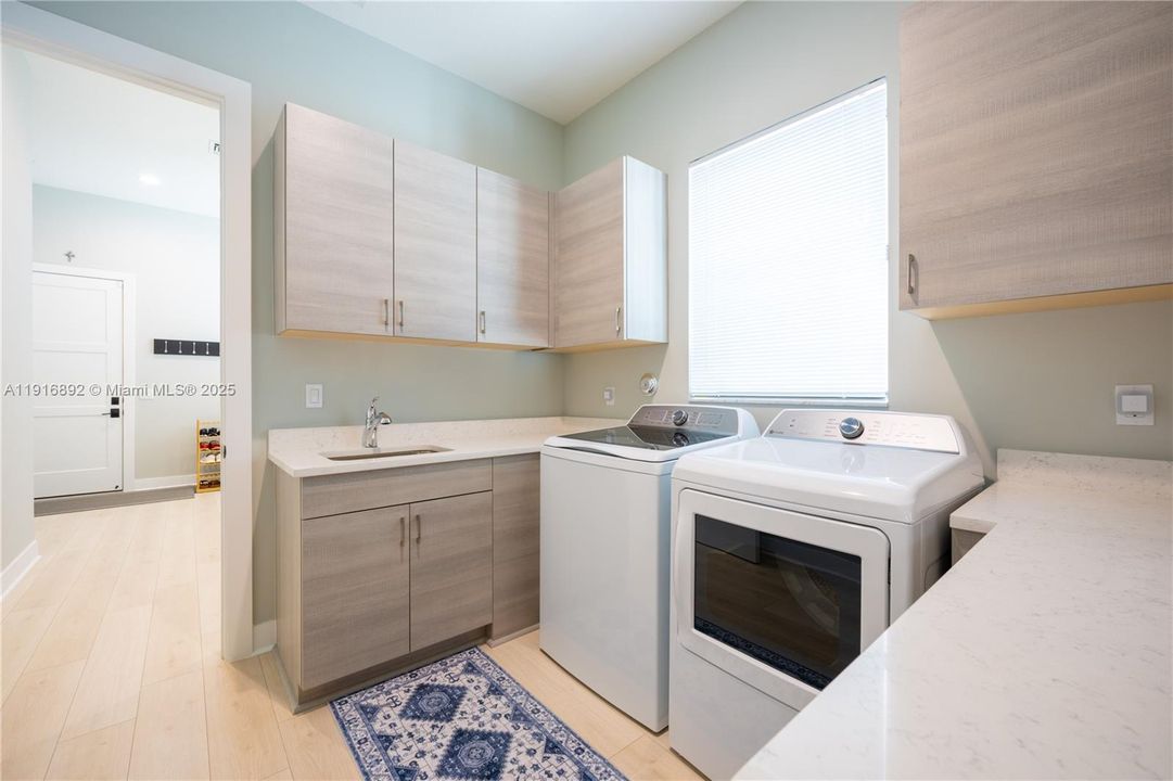 Downstairs laundry room with lots of storage