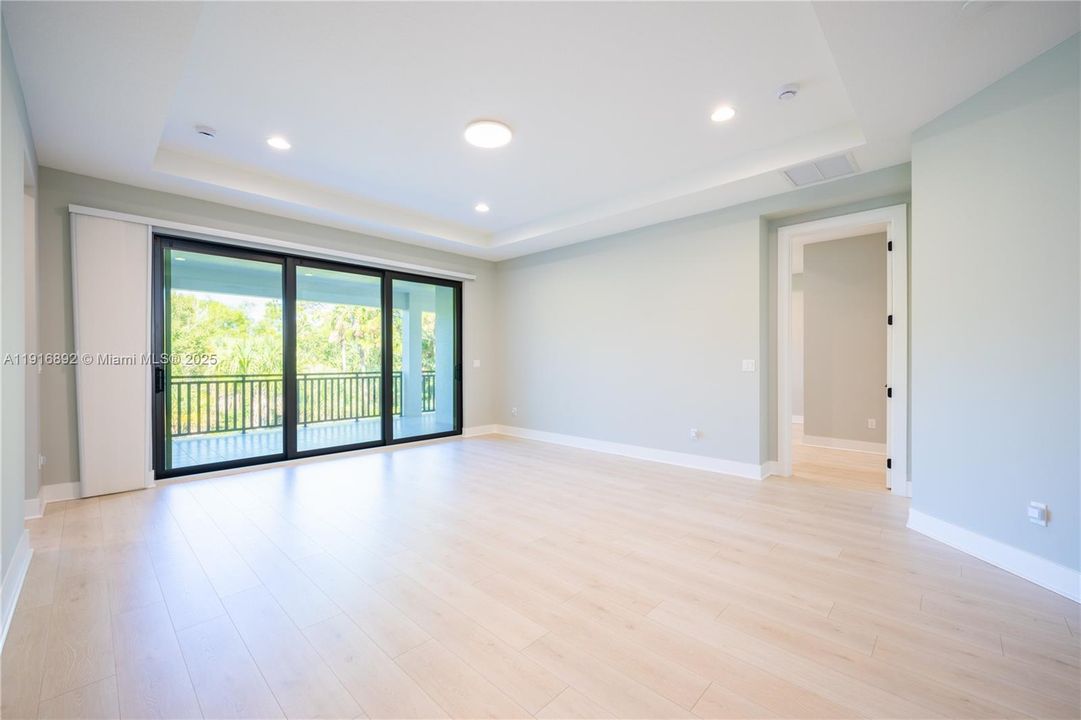 Versatile loft area that walks out onto the serene covered balcony