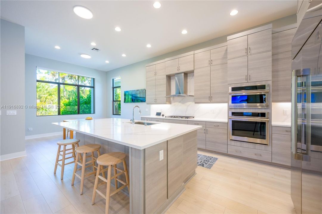 Chef's kitchen with quartz countertop and high-end finishes