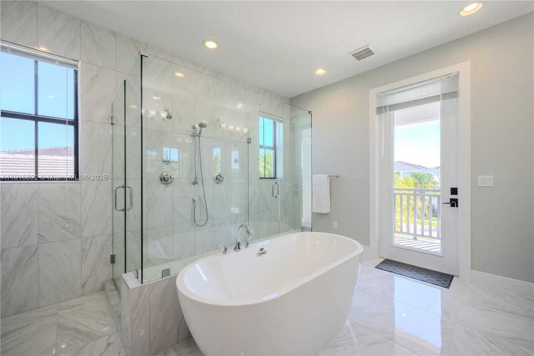 Master bathroom upstairs with balcony access