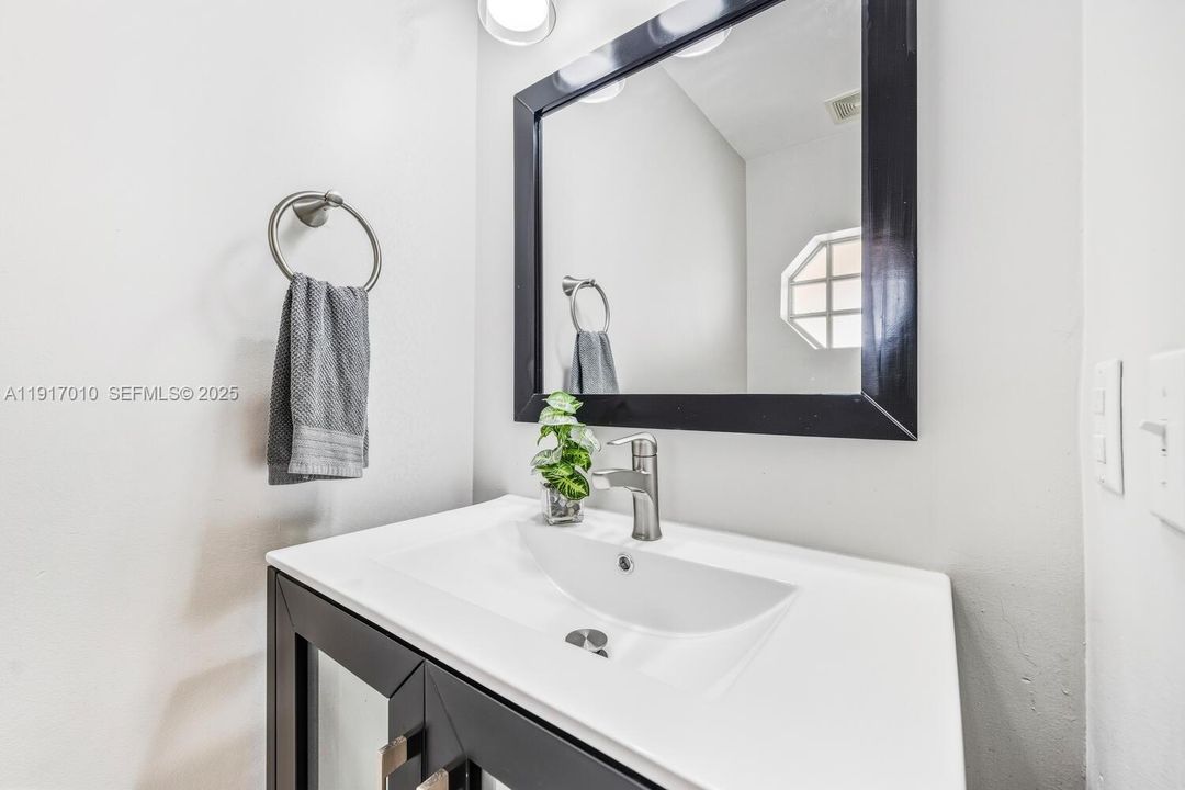 View as you enter - Garage access on the right and Half Bath on the left.