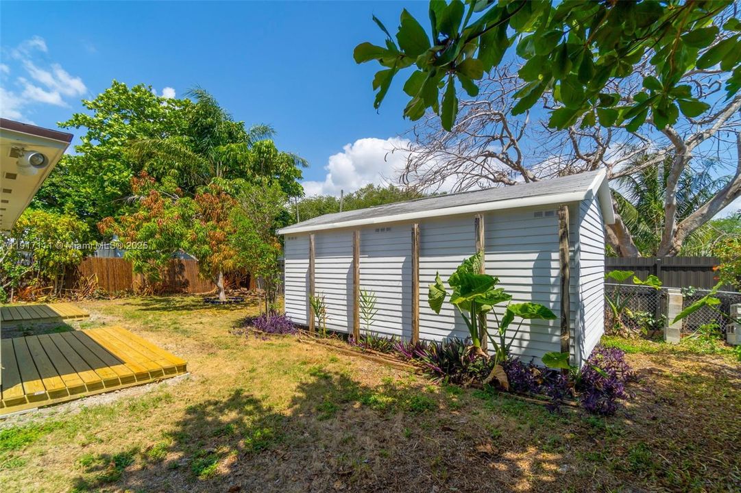 LARGE SHED IN BACKYARD