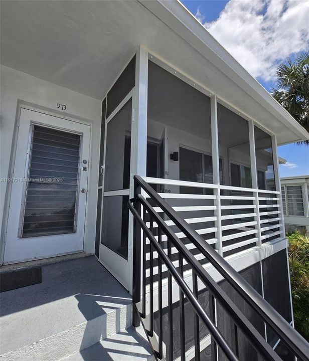 Entry via screened in porch