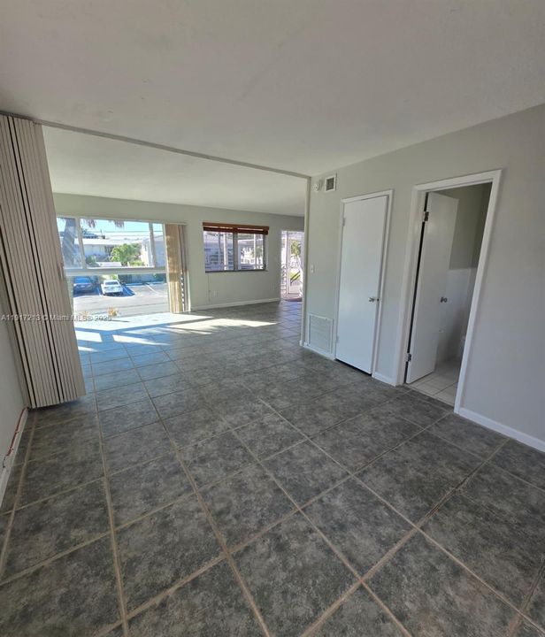 Bedroom with expandable divider