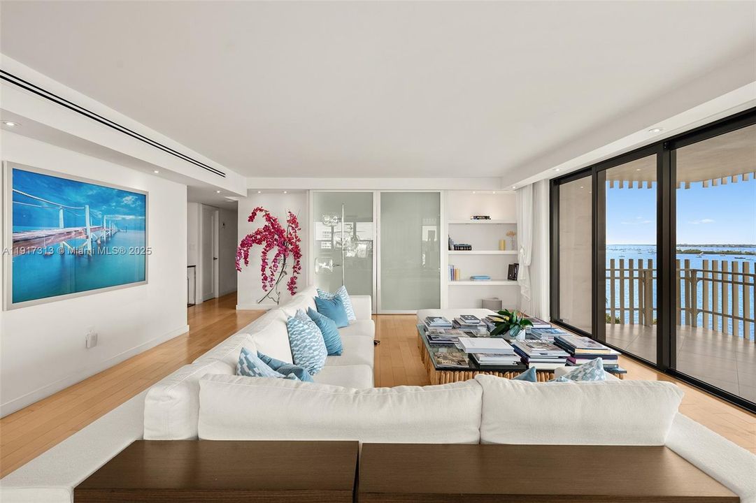 living room looking to Den/ 3rd Bedroom with sliding doors