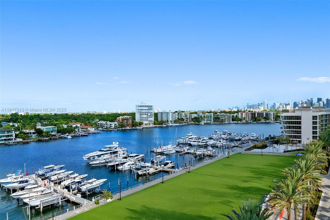 AI Modified photo. View of Marina and Downtown Miami Skyline. Where the green is this area is currently under construction and will soon be the tennis and pickleball courts.