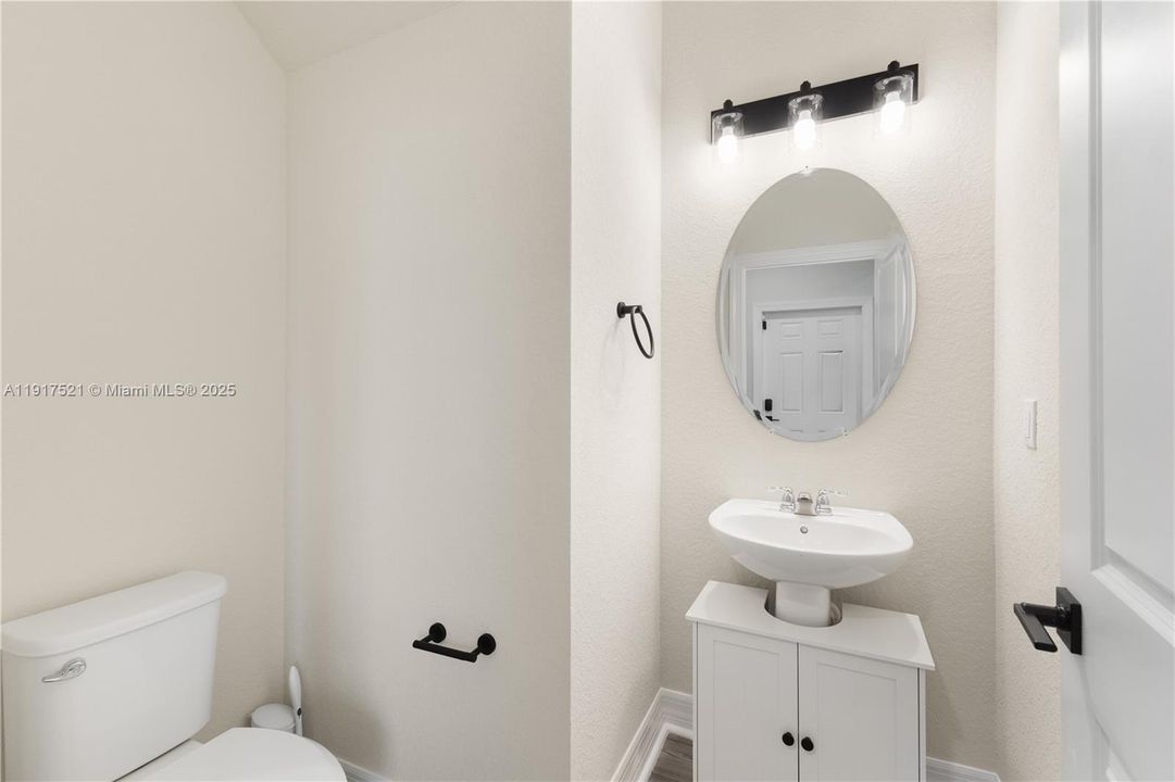 Powder room conveniently located downstairs