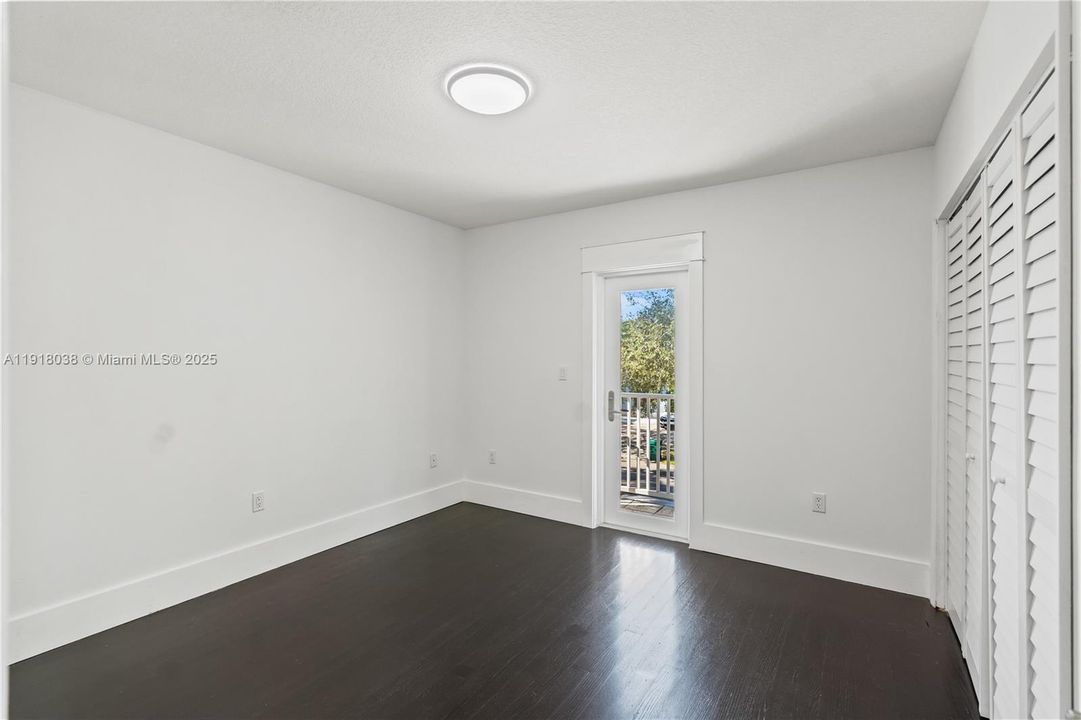 Upstairs bedroom with balcony