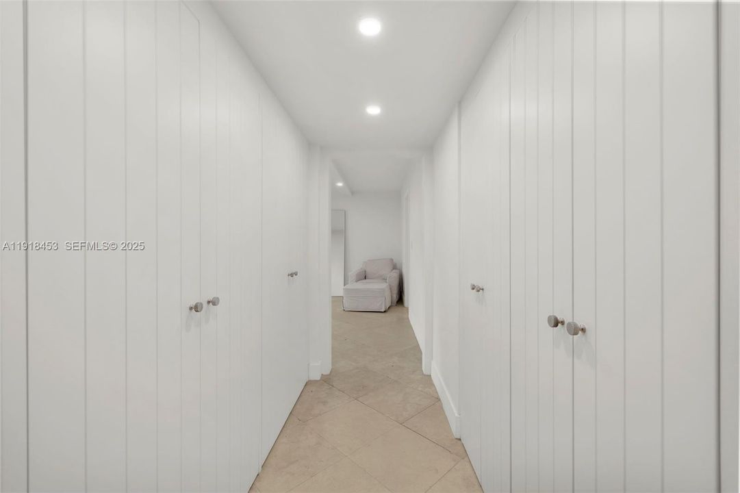 CLOSETS ON BOTH SIDES OF HALLWAY TO MASTER BEDROOM