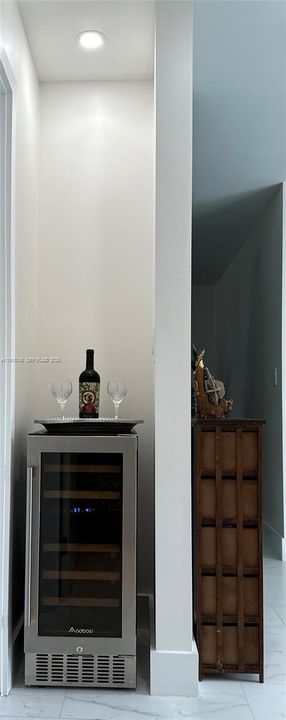 Dining leading to half bath and garage