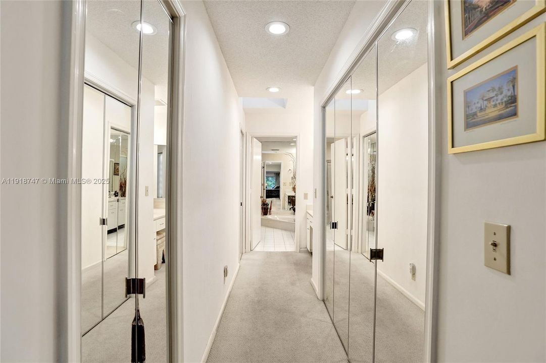 Hall with closets to the bathroom