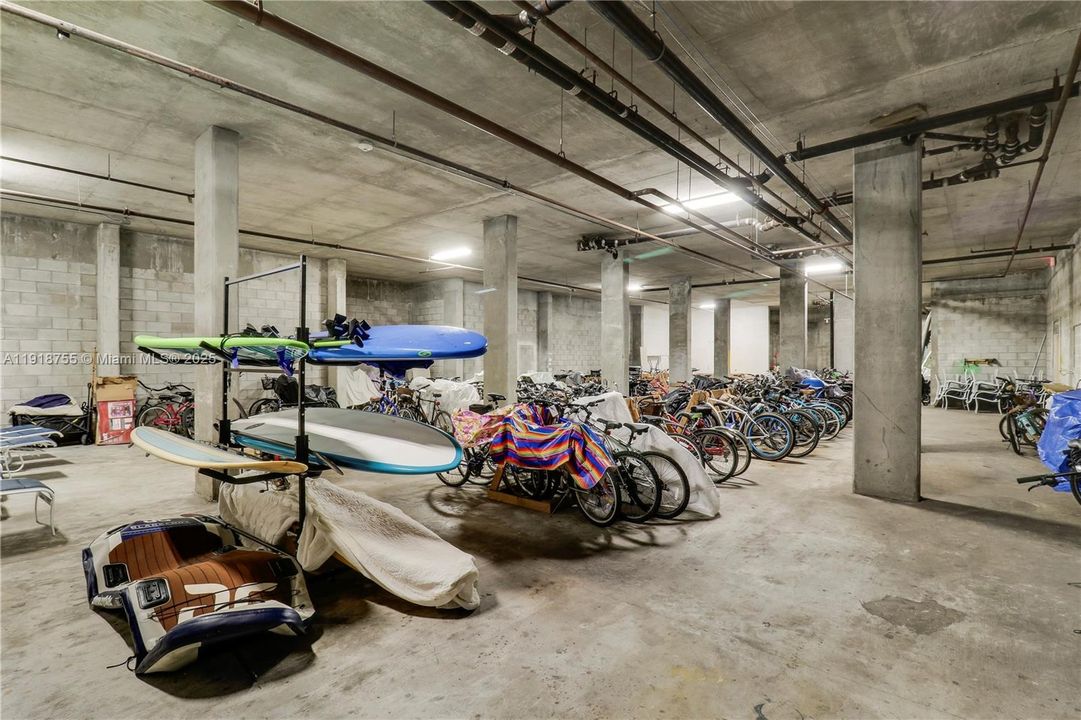 Kayak, paddleboard, and bicycle storage room located in the garage.