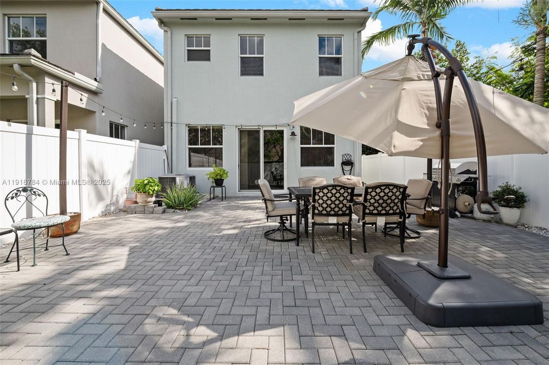 Your private outdoor oasis—perfect for morning coffee, grilling, or gatherings. Patio furniture is included in the sale at no additional costs to you!