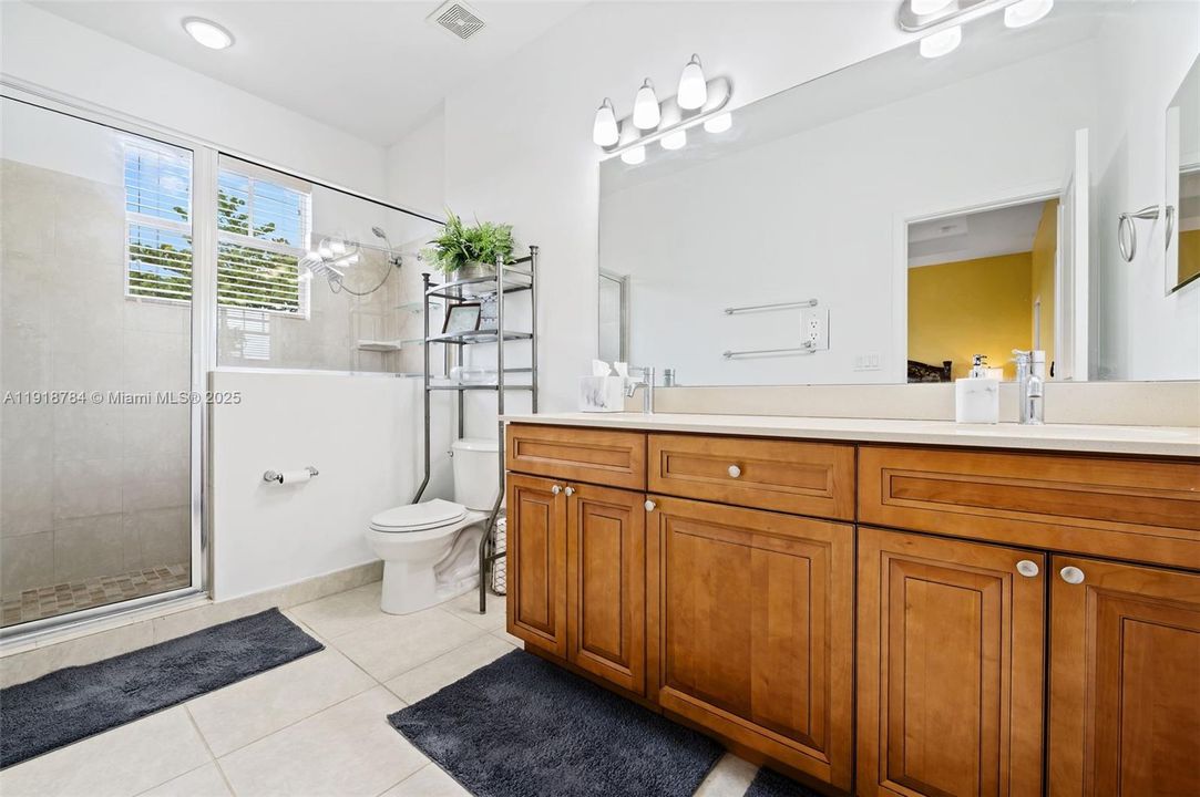 Fresh, clean bathroom with great storage and natural light