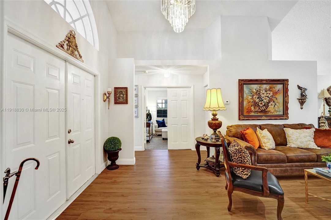 inviting front entry area all is recently painted.   laminate floors in all except the bedrooms