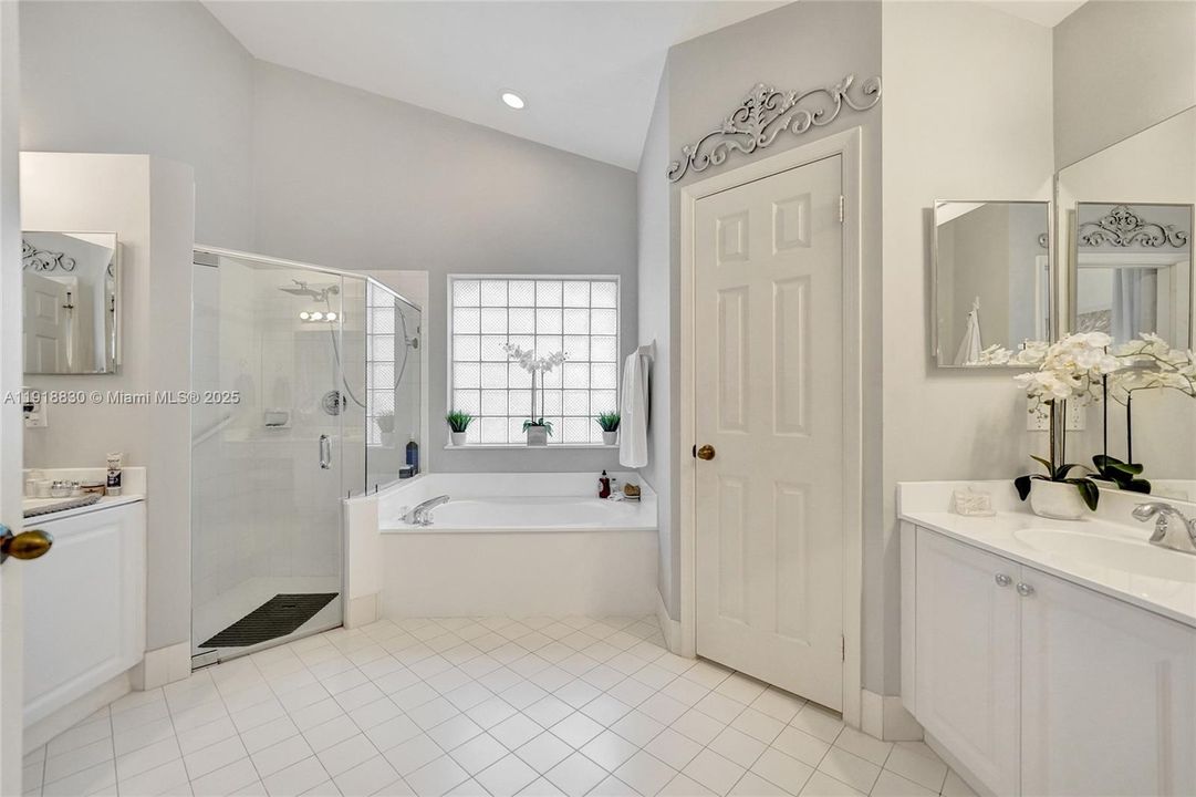 ensuite bathroom double vanity separate tub and shower and water closet