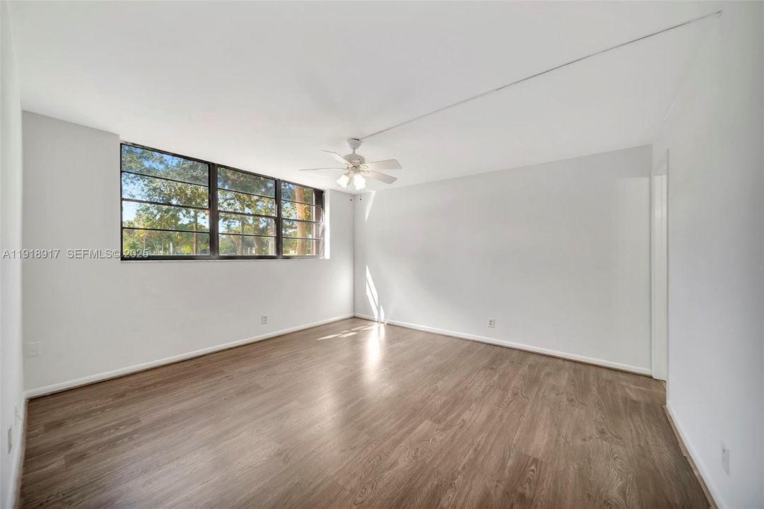 Primary Bedroom with new wood laminate flooring