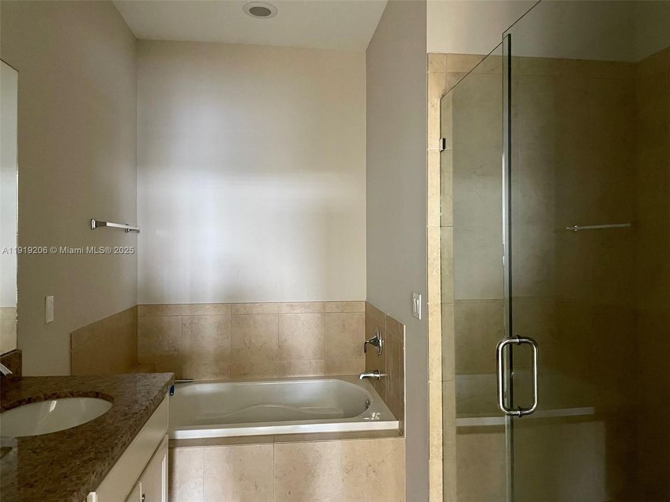 Master Bath with Glass Enclosed Shower + Soak Tub